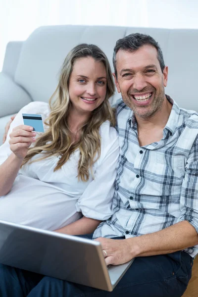 Expecting couple sitting on floor — Stock Photo, Image