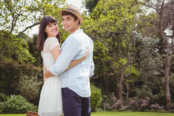 Young couple embracing outdoors — Stock Photo, Image