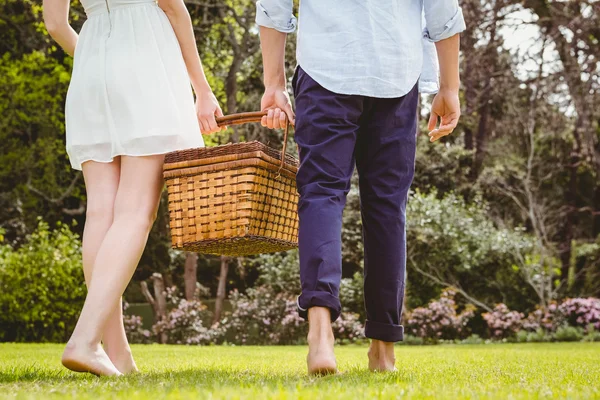 Young couple walking in garden — Stock Photo, Image