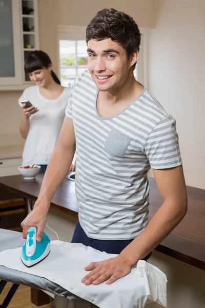 Man ironing a shirt — Stock Photo, Image