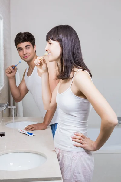 Bathroom routine for happy young couple — Stock Photo, Image