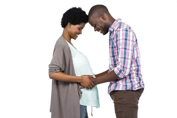 Man touching pregnant womans stomach — Stock Photo, Image