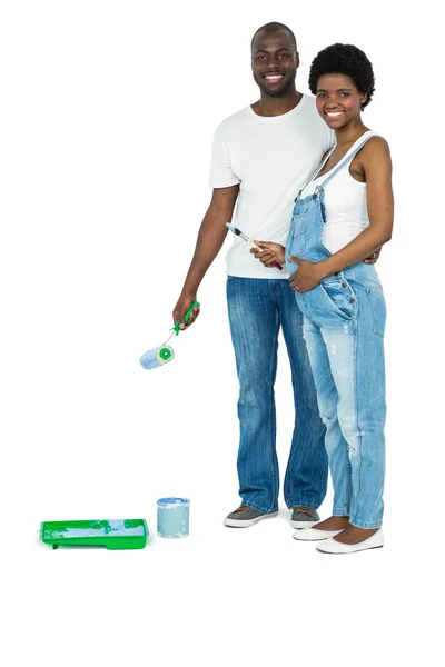 Pregnant couple with blue paint tin — Stock Photo, Image