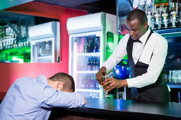 Drunk man sleeping with his head — Stock Photo, Image