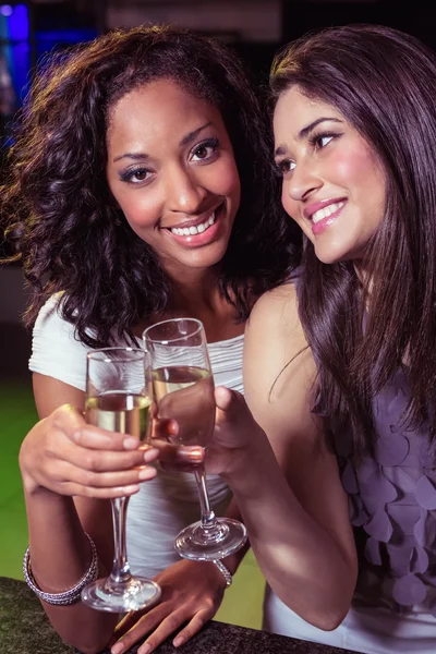 Happy young women having champagne — Stock Photo, Image