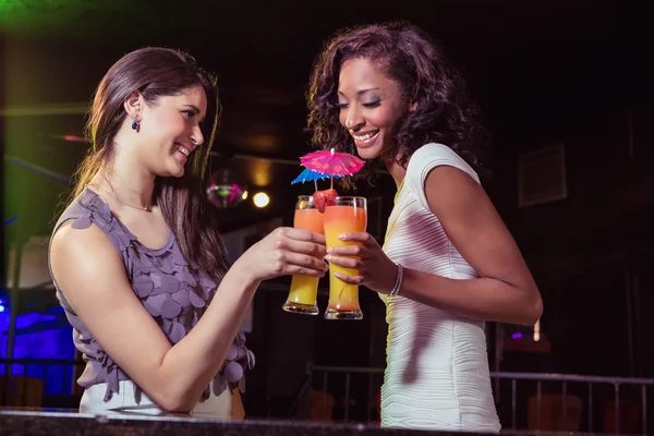 Happy young women having cocktail — Stock Photo, Image