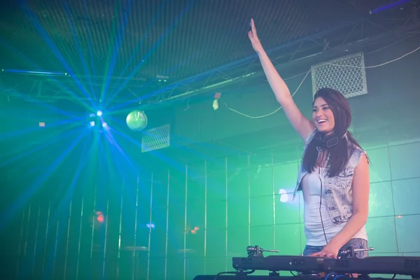 Pretty female DJ having fun while playing music — Stock Photo, Image