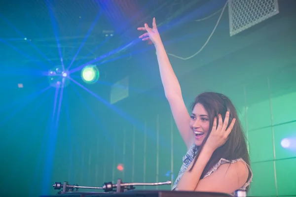 Pretty female DJ waving her hand — Stock Photo, Image