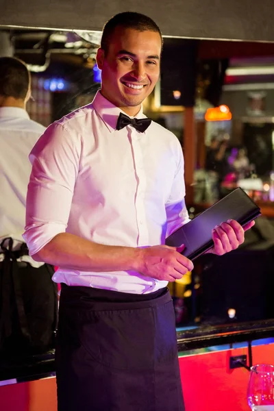 Waiter standing with his arms crossed — Stock Photo, Image