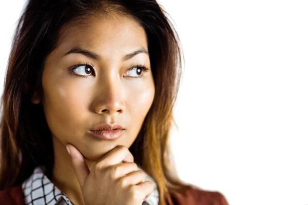 Serious businesswoman holding her chin — Stock Photo, Image