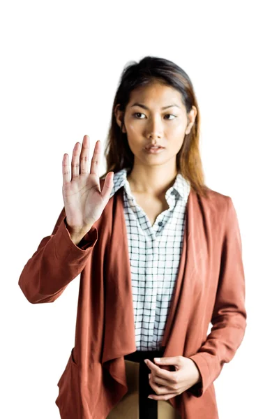 Mujer de negocios seria mostrando su mano —  Fotos de Stock