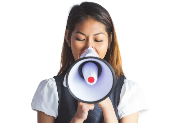 Businesswoman shooting through a megaphone — Stock Photo, Image