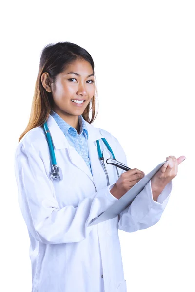 Asian doctor writing on files — Stock Photo, Image