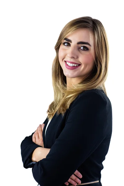 Smiling woman with arms crossed looking at the camera — Stock Photo, Image