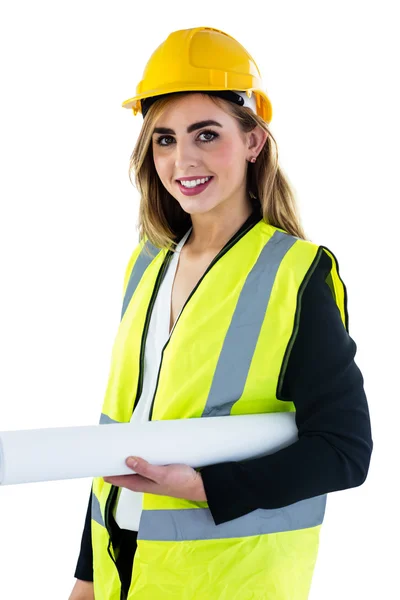 Sorrindo mulher segurando plano de construção — Fotografia de Stock