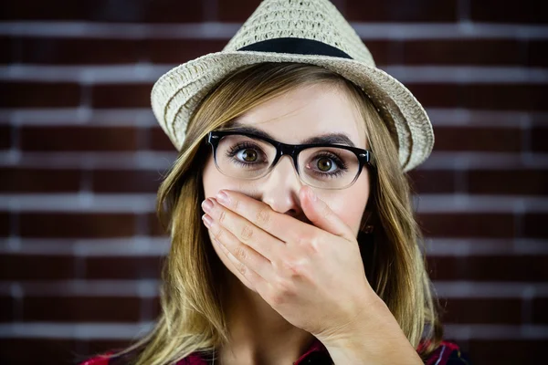 Woman covering her mouth with her hand — Stock Photo, Image