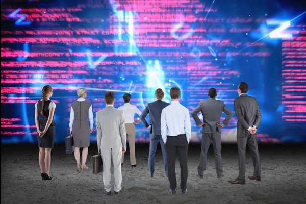 Businessmen and businesswomen looking at data — Stock Photo, Image