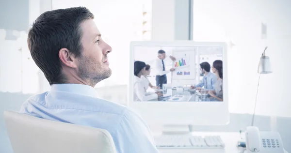 Businessman sitting at his desk — Stock Photo, Image