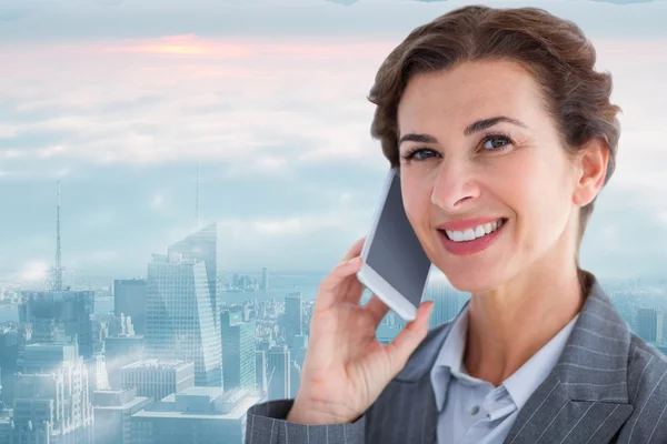 Composite image of portrait of beautiful businesswoman talking o — Stock Photo, Image