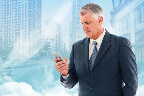 Composite image of businessman using his smartphone — Stock Photo, Image