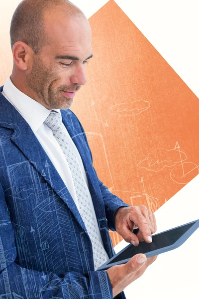 Composite image of businessman using a tablet — Stock Photo, Image