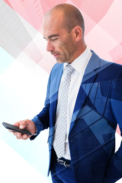Composietbeeld van zakenman texting met zijn smartphone — Stockfoto