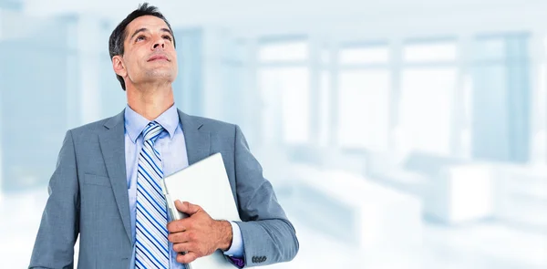 Businessman holding his laptop a — Stock Photo, Image