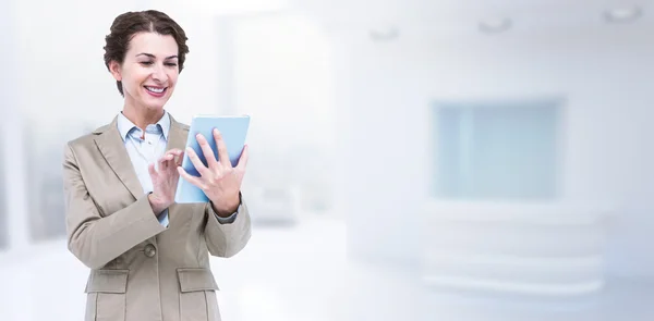 Smiling businesswoman using tablet — Stock Photo, Image