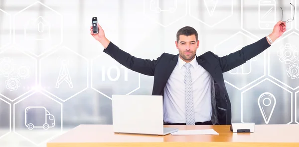 Businessman holding phone and glasses — Stock Photo, Image