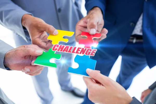 Business colleagues holding piece of puzzle — Stock Photo, Image