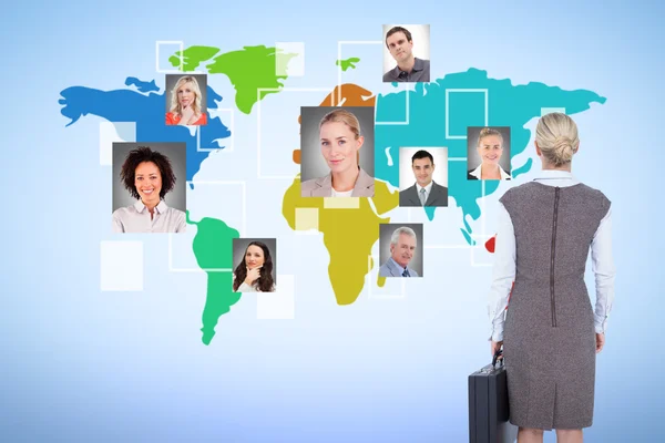 Back turned businesswoman holding a briefcase — Stock Photo, Image