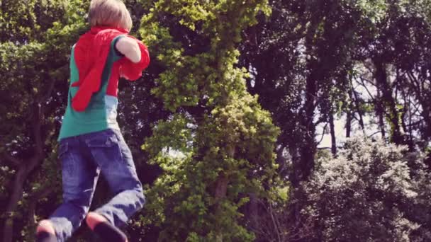 Boy pretending to be superhero — Stock Video