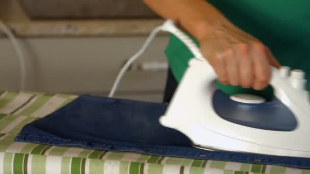 Woman ironing her clothing — Stock Video