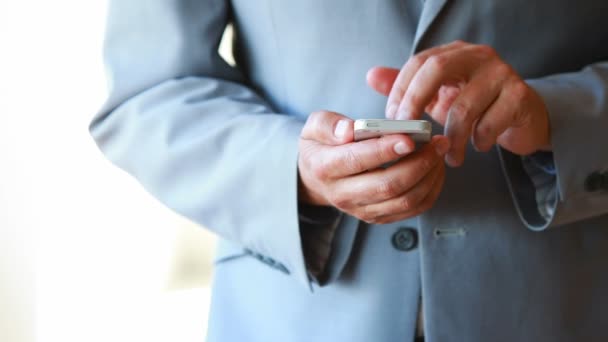 Businessman using a smartphone — Stock Video