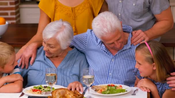 Family standing in front of the kitchen table — Stock Video