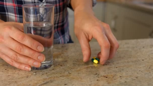 A woman taking a pills — Stock Video