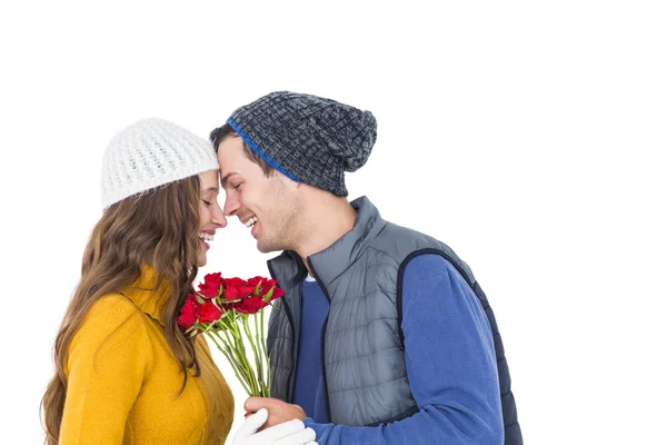 Happy couple holding a flower bouquet — Stock Photo, Image