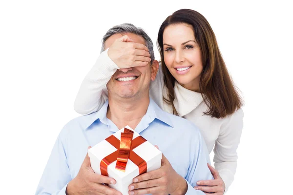 Woman  offering present to husband — Stock Photo, Image