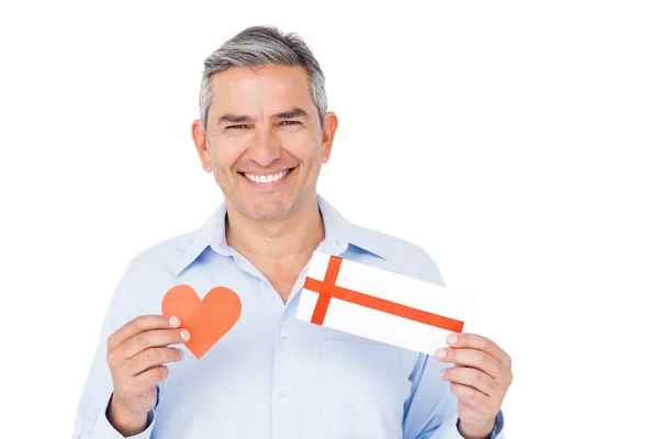 Man showing present and paper heart — Stock Photo, Image