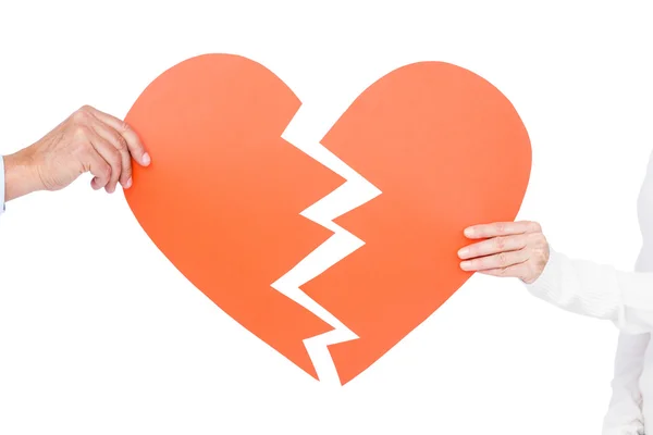 Couple holding broken heart — Stock Photo, Image