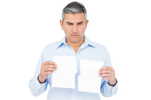 Man holding ripped paper — Stock Photo, Image