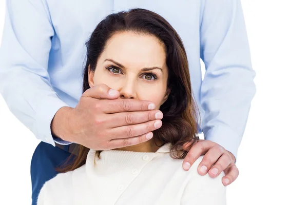 Man covering wife's mouth — Stock Photo, Image