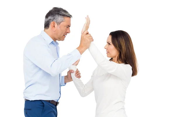 Violent man grabbing wife's wrists — Stock Photo, Image