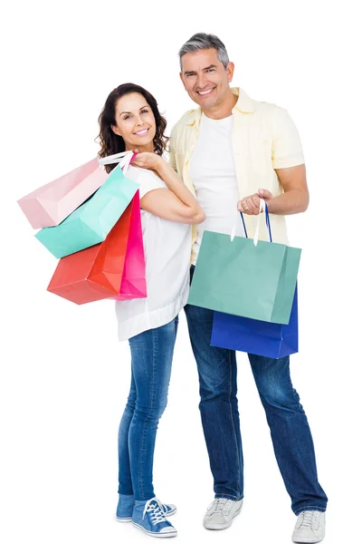 Casal segurando sacos de compras — Fotografia de Stock