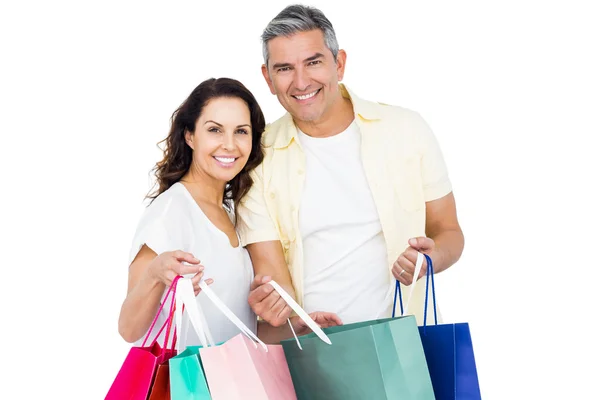 Casal segurando sacos de compras — Fotografia de Stock