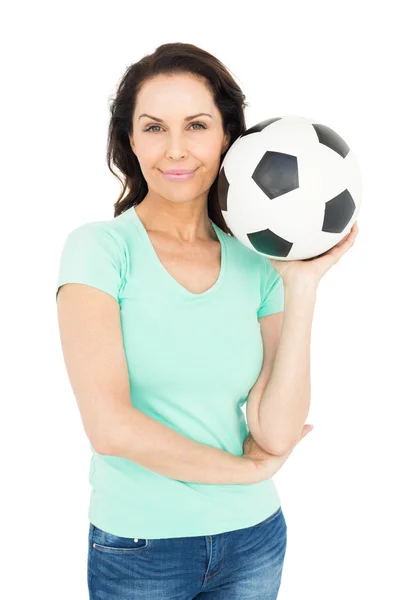 Brunette holding soccer ball — Stock Photo, Image