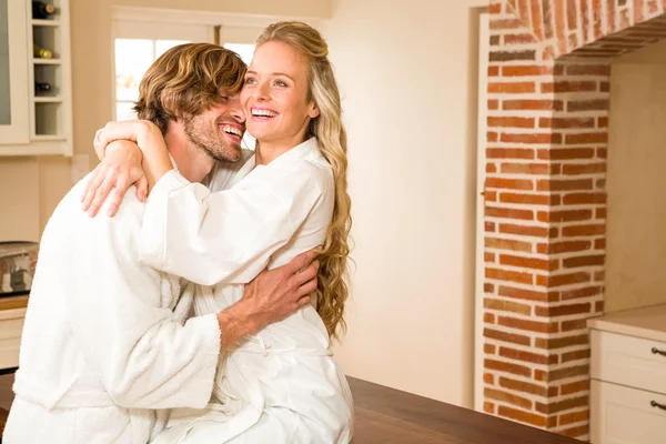 Couple cuddling with girlfriend sitting — Stock Photo, Image