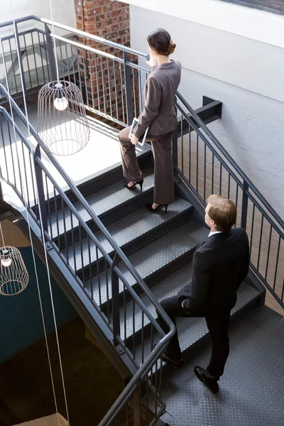 Businesspeople climbing the staircase — Stock Photo, Image