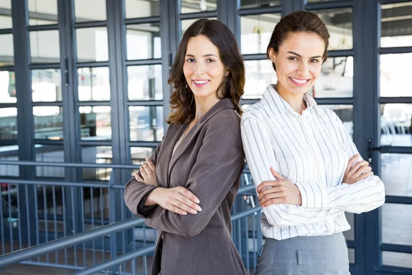 Businesswomen standing  in office — Stock Photo, Image