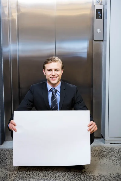 Empresario con un letrero —  Fotos de Stock